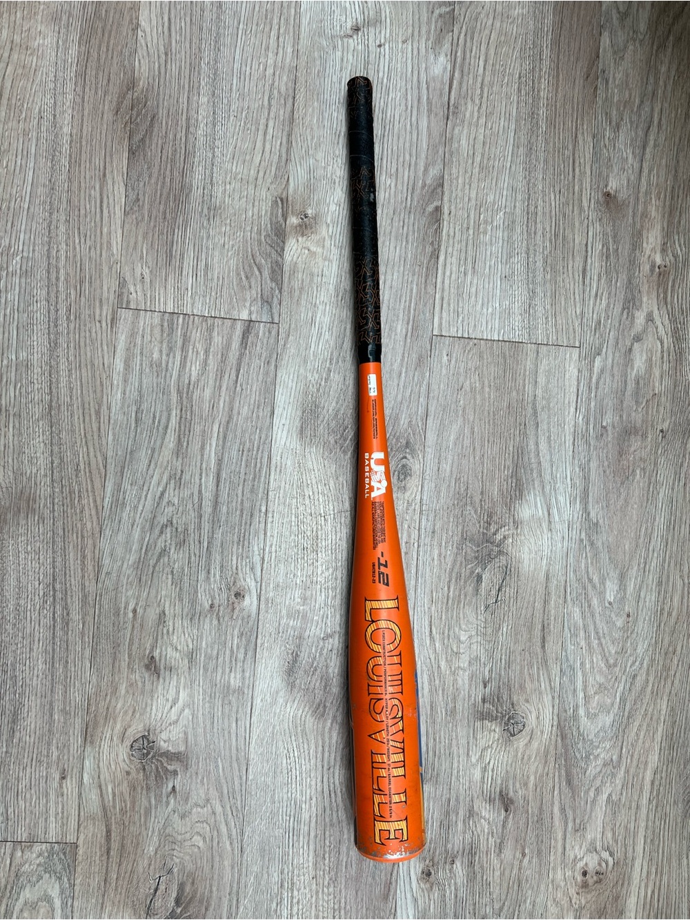 Louisville Slugger Youth Baseball Bat in Orange with Black Grip